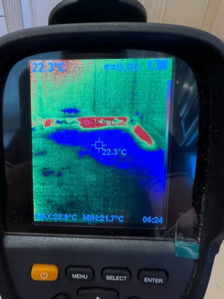 Thermal camera showing water spread under kitchen cabinets after a dishwasher supply line leak in Calabasas