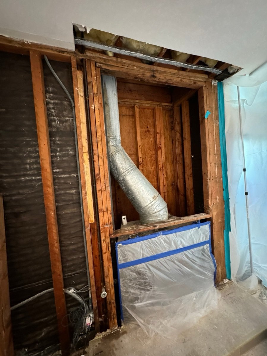 Chimney chase opened and contained with plastic in a Santa Monica condo building
