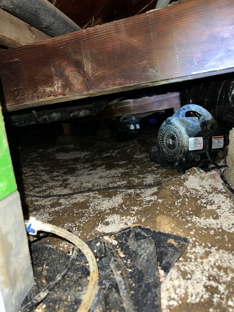 Air movers drying a flooded crawl space under a Culver City home