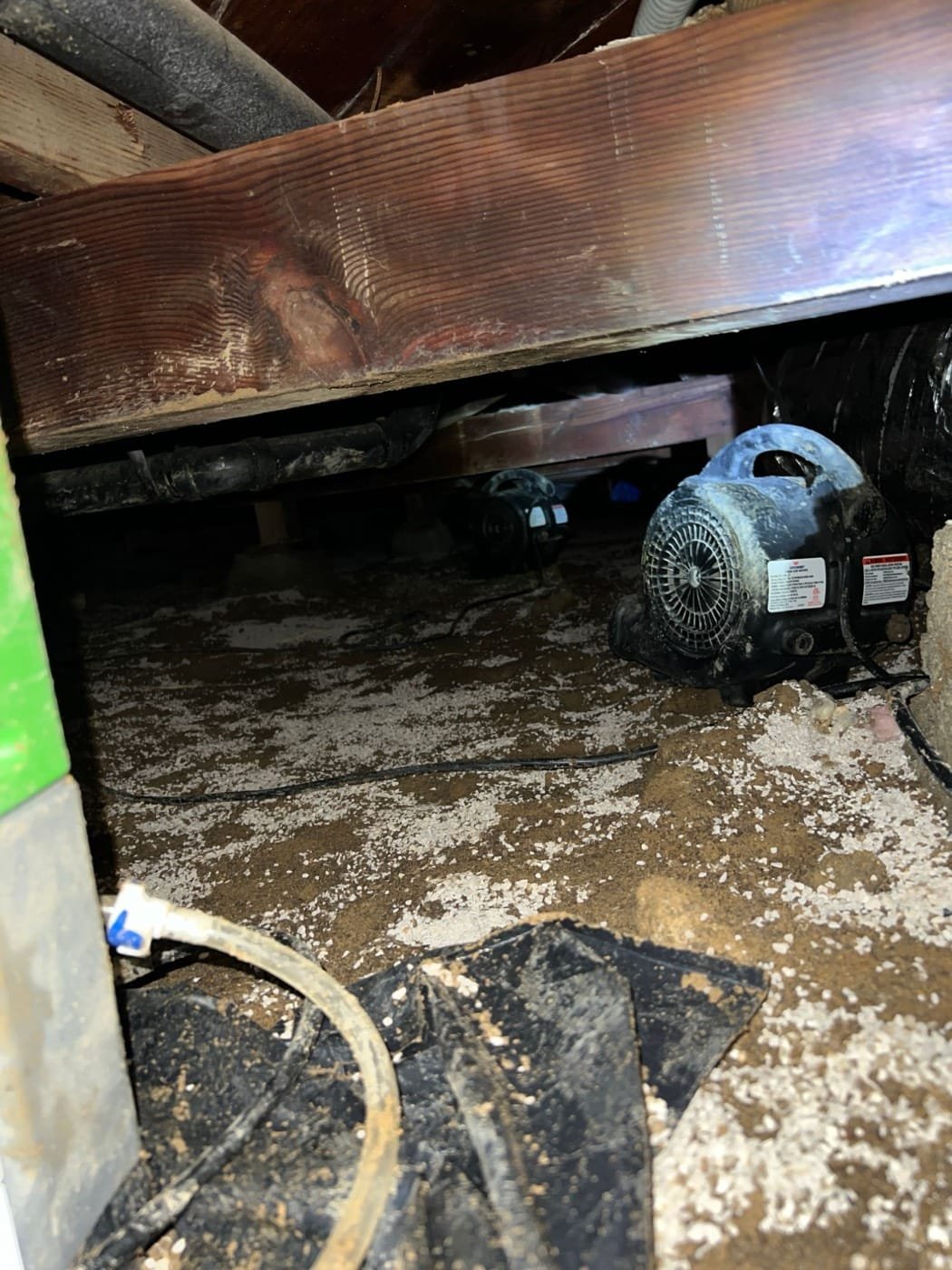 Air movers drying a flooded crawl space under a Culver City home