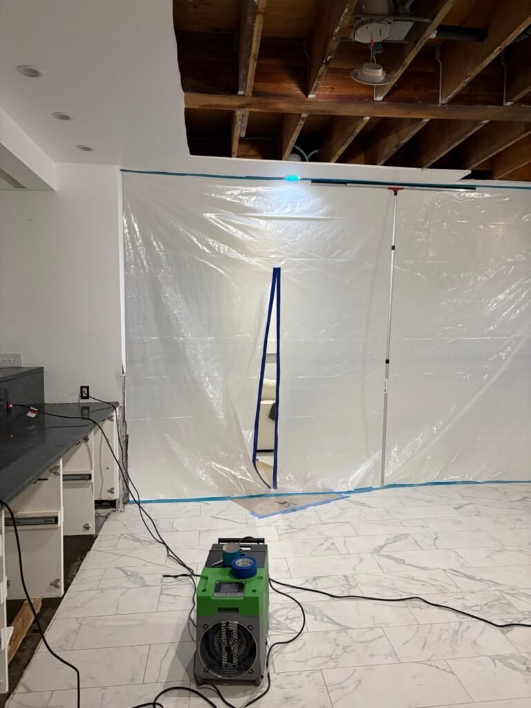 Containment and opened ceiling with drying equipment after a jacuzzi drain leak in a Malibu home