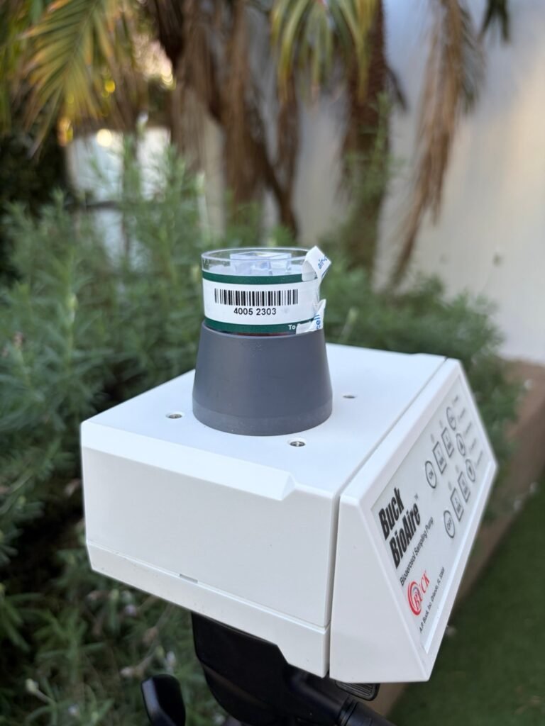 Air sampling pump collecting an outdoor comparison sample after mold remediation in Malibu