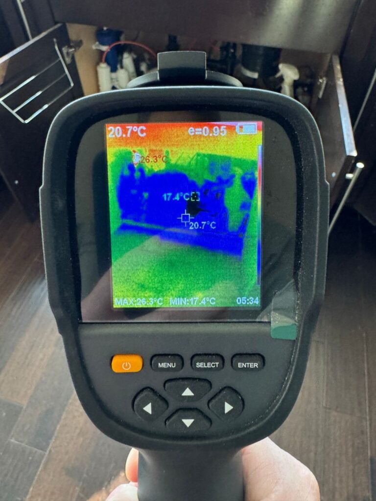 Thermal camera showing water spread under the sink cabinet after a refrigerator line leak in Sherman Oaks